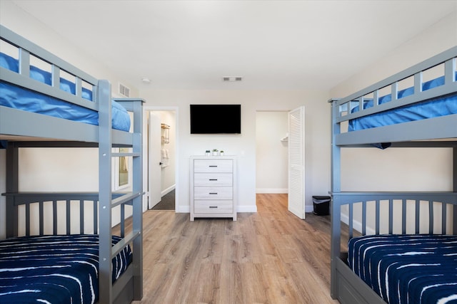 bedroom with light wood-type flooring