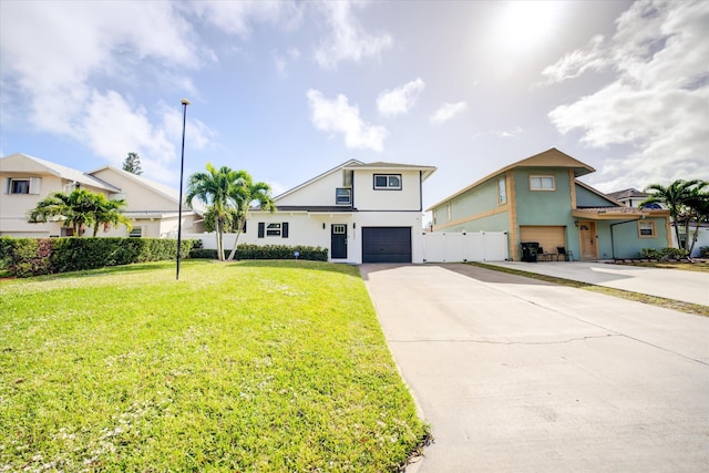 front facade featuring a front yard and a garage