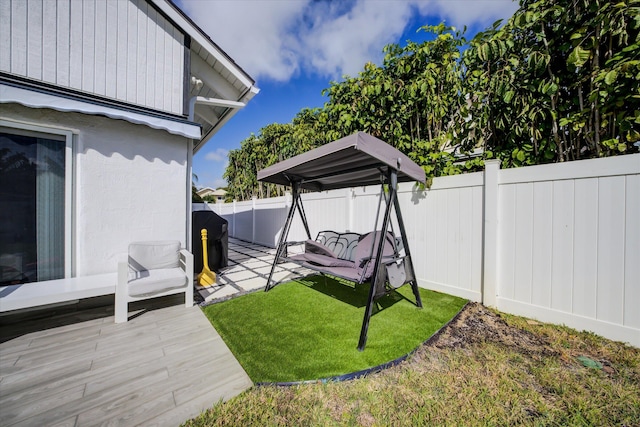 view of yard with a wooden deck