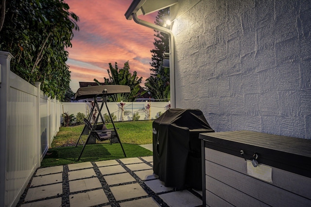 patio terrace at dusk with a yard