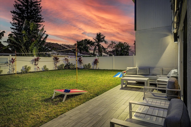 yard at dusk featuring a patio area and an outdoor hangout area