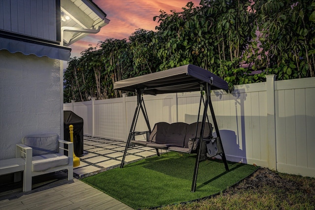 yard at dusk with a patio