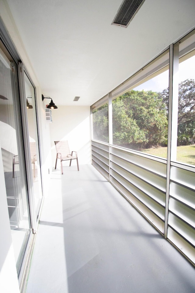 unfurnished sunroom with plenty of natural light