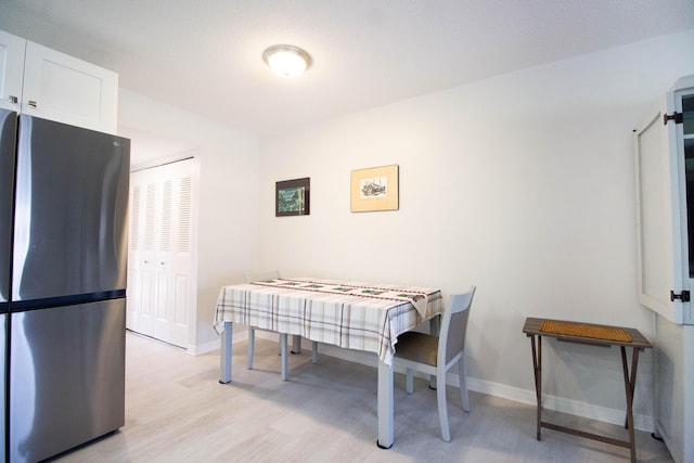 dining room featuring light wood-type flooring