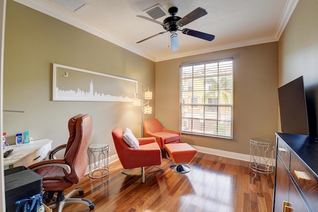 office space with hardwood / wood-style floors, ceiling fan, and crown molding