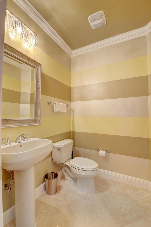 bathroom featuring toilet, tile patterned flooring, and ornamental molding