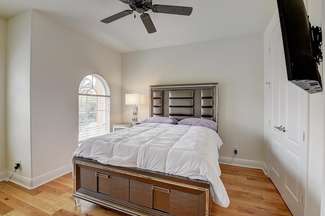 bedroom with ceiling fan and light hardwood / wood-style floors