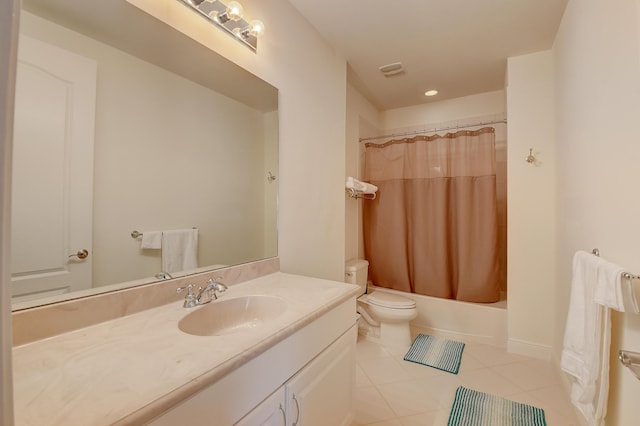 full bathroom featuring tile patterned floors, vanity, toilet, and shower / bath combo with shower curtain