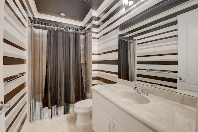 bathroom with vanity, toilet, and curtained shower