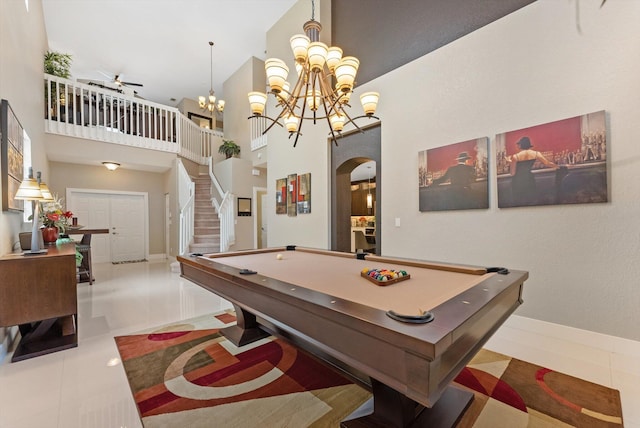 playroom featuring light tile patterned floors, ceiling fan with notable chandelier, a high ceiling, and billiards