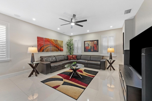 living room with ceiling fan and light tile patterned floors