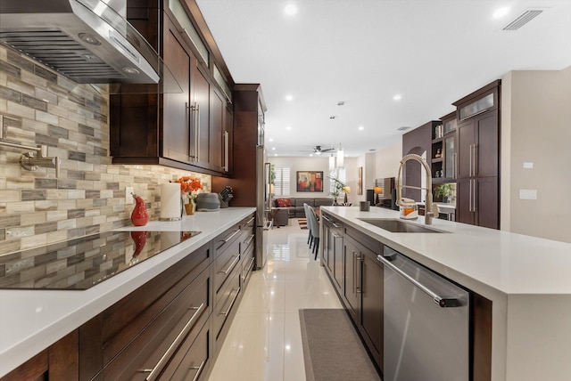 kitchen with dishwasher, sink, wall chimney range hood, tasteful backsplash, and black electric cooktop