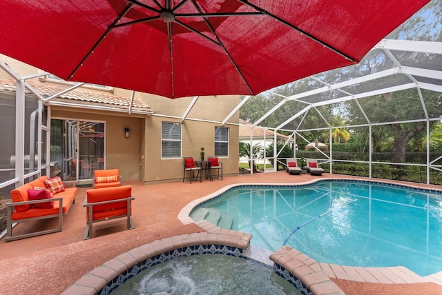 view of swimming pool featuring a patio area, an in ground hot tub, and glass enclosure