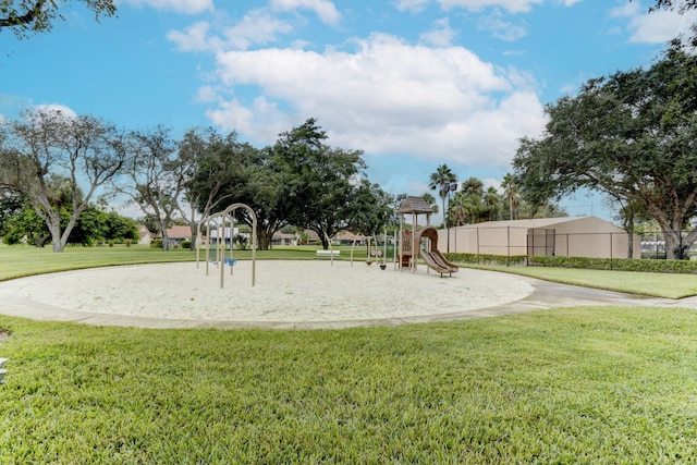 view of playground with a lawn