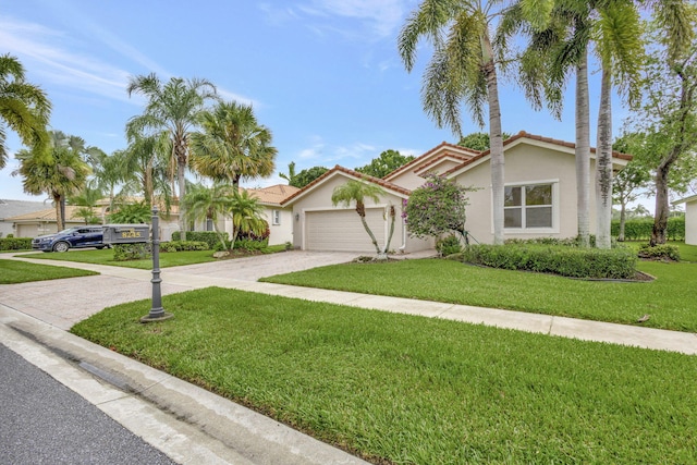 view of front facade featuring a front yard and a garage