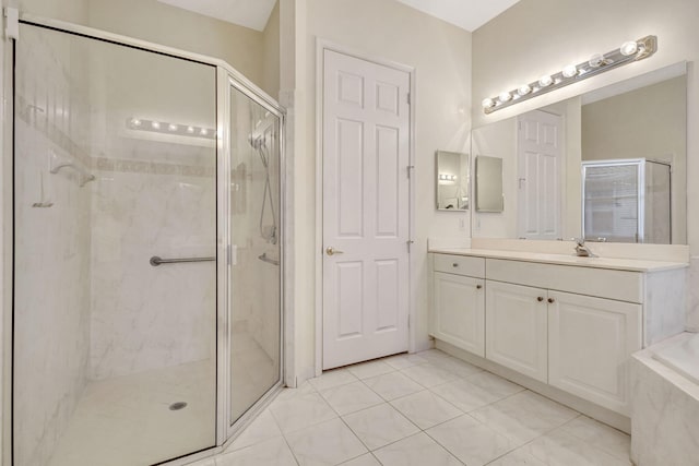 bathroom with vanity, tile patterned flooring, and walk in shower