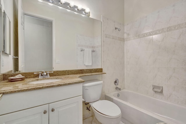 full bathroom featuring tiled shower / bath combo, vanity, and toilet