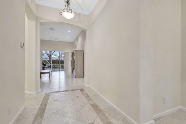 hallway with light tile patterned floors