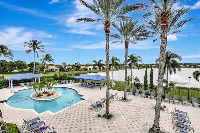 view of swimming pool featuring a gazebo, a water view, and a patio area