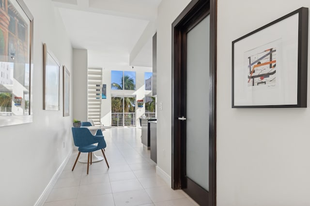 hall with light tile patterned flooring