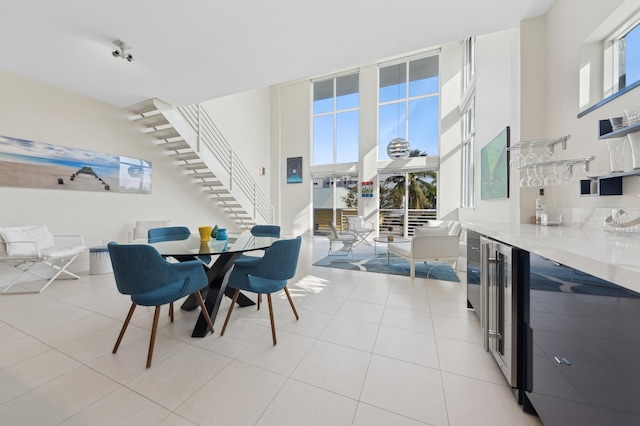 dining room with plenty of natural light and light tile patterned floors