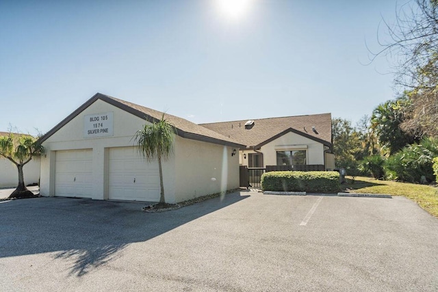 single story home featuring a garage