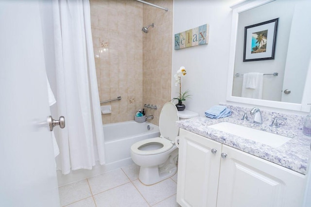 full bathroom featuring tile patterned floors, vanity, toilet, and shower / bath combo with shower curtain