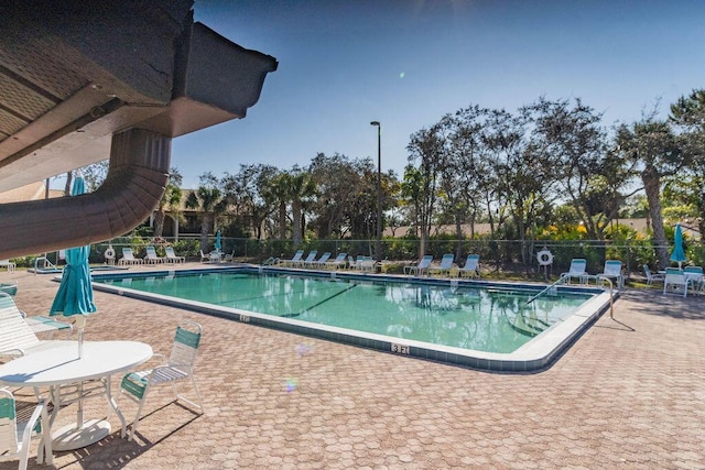 view of swimming pool with a patio area