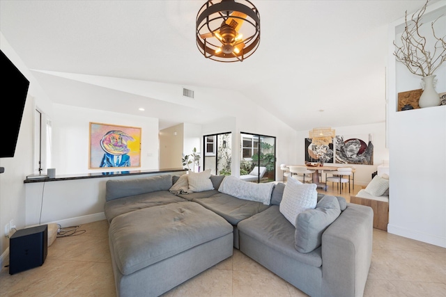 living room with light tile patterned floors, vaulted ceiling, and ceiling fan