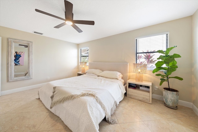 tiled bedroom with ceiling fan