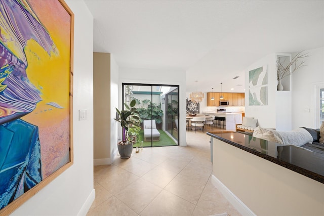 interior space with a healthy amount of sunlight and light tile patterned flooring