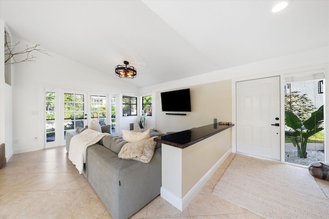 tiled living room with lofted ceiling