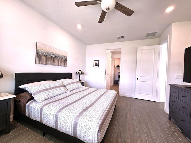 bedroom with ceiling fan and dark wood-type flooring