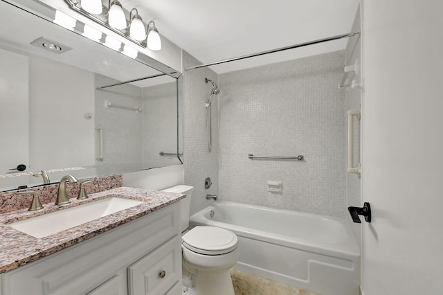 full bathroom with tile patterned flooring, vanity, toilet, and tiled shower / bath