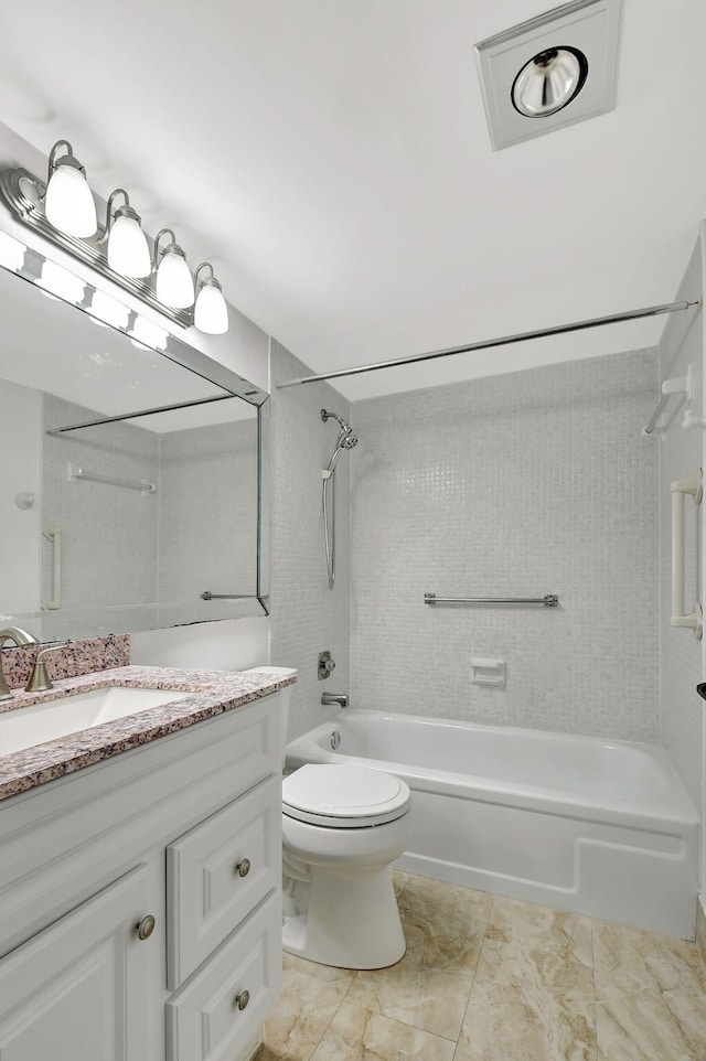 full bathroom featuring vanity, toilet, and tiled shower / bath combo