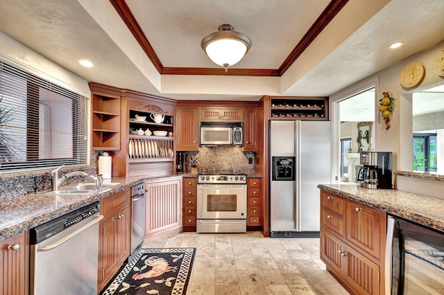 kitchen featuring light stone countertops, appliances with stainless steel finishes, wine cooler, and sink