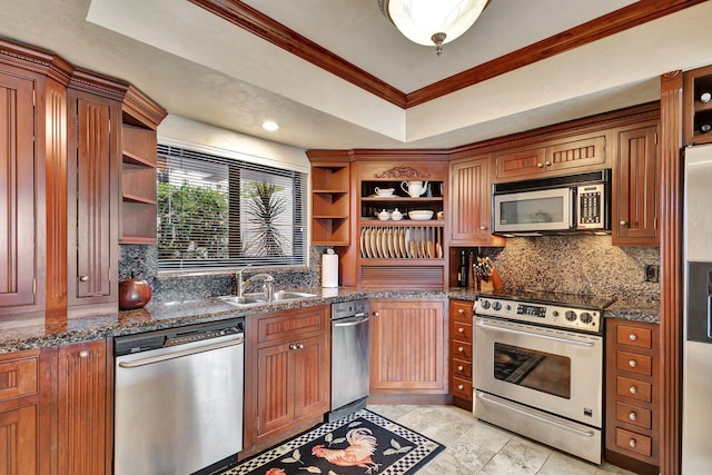 kitchen featuring dark stone countertops, sink, ornamental molding, and stainless steel appliances