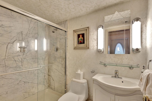 bathroom featuring vanity, toilet, and a shower with shower door