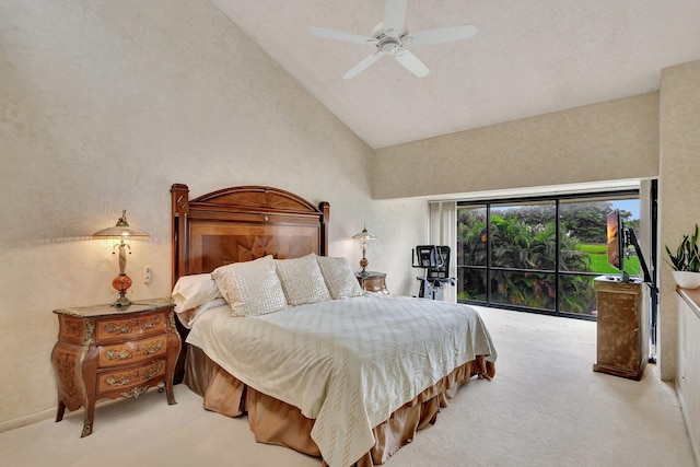 carpeted bedroom featuring ceiling fan and high vaulted ceiling