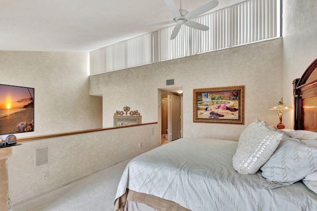 carpeted bedroom featuring ceiling fan and high vaulted ceiling