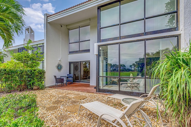 rear view of property featuring a patio area