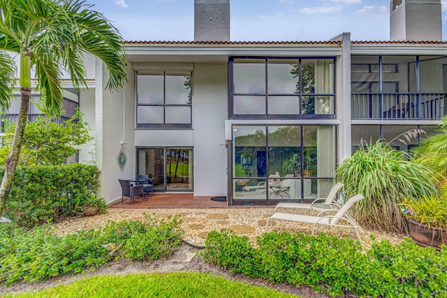 back of property featuring a patio area