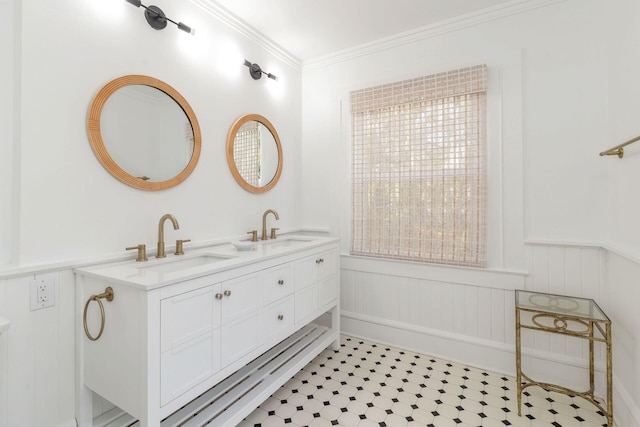 bathroom featuring crown molding, tile patterned flooring, and vanity