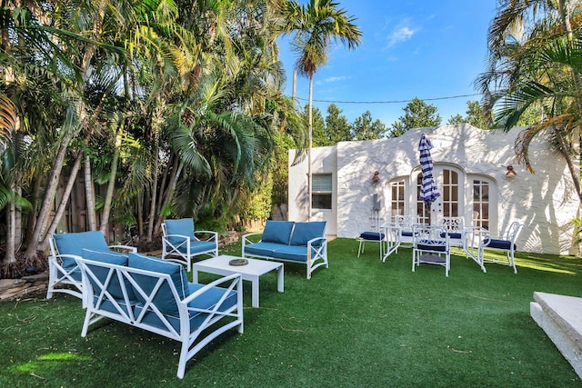 exterior space featuring a lawn and an outdoor living space