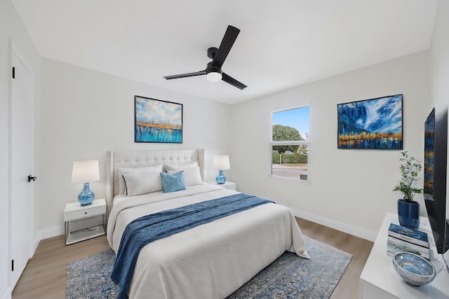 bedroom featuring ceiling fan and light wood-type flooring