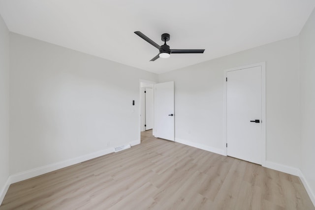 unfurnished bedroom featuring a closet, ceiling fan, and light hardwood / wood-style flooring