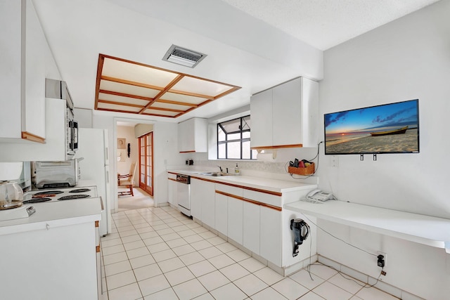 kitchen with white cabinetry, sink, and white dishwasher