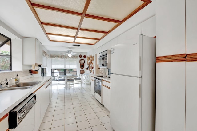 kitchen with ceiling fan, sink, white cabinets, and white appliances