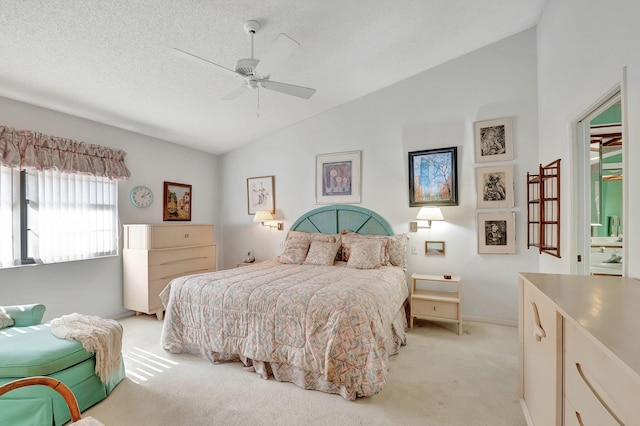 carpeted bedroom featuring a textured ceiling, ceiling fan, and lofted ceiling