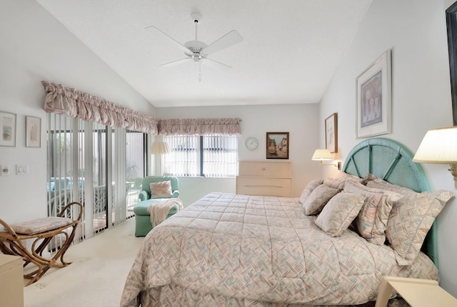 carpeted bedroom featuring vaulted ceiling and ceiling fan